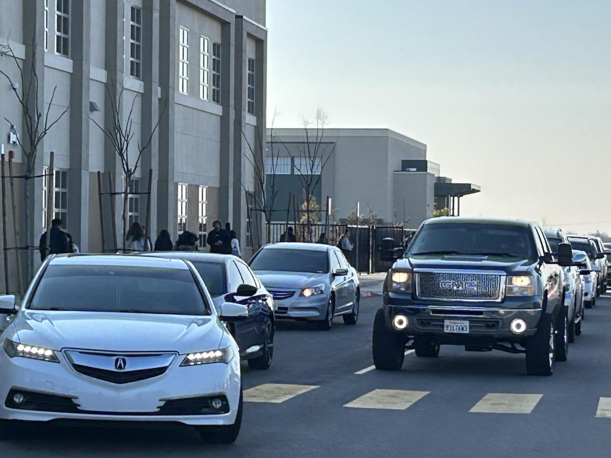 Cars line up after school for pick up in front of the new campus.