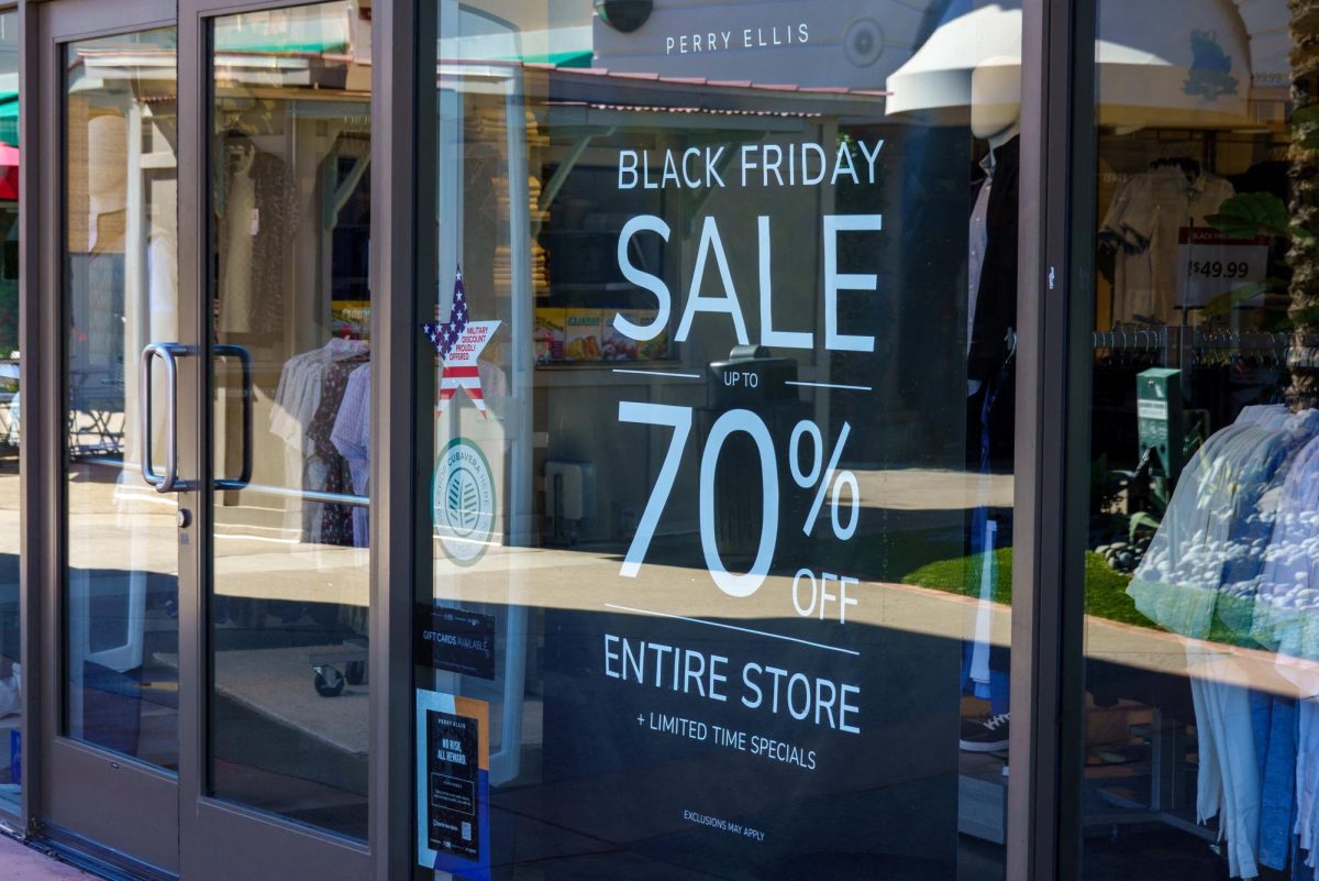 A Black Friday sale sign is displayed in a shop window at an outlet mall in Carlsbad, California, U.S., November 25, 2025.   REUTERS/Mike Blake