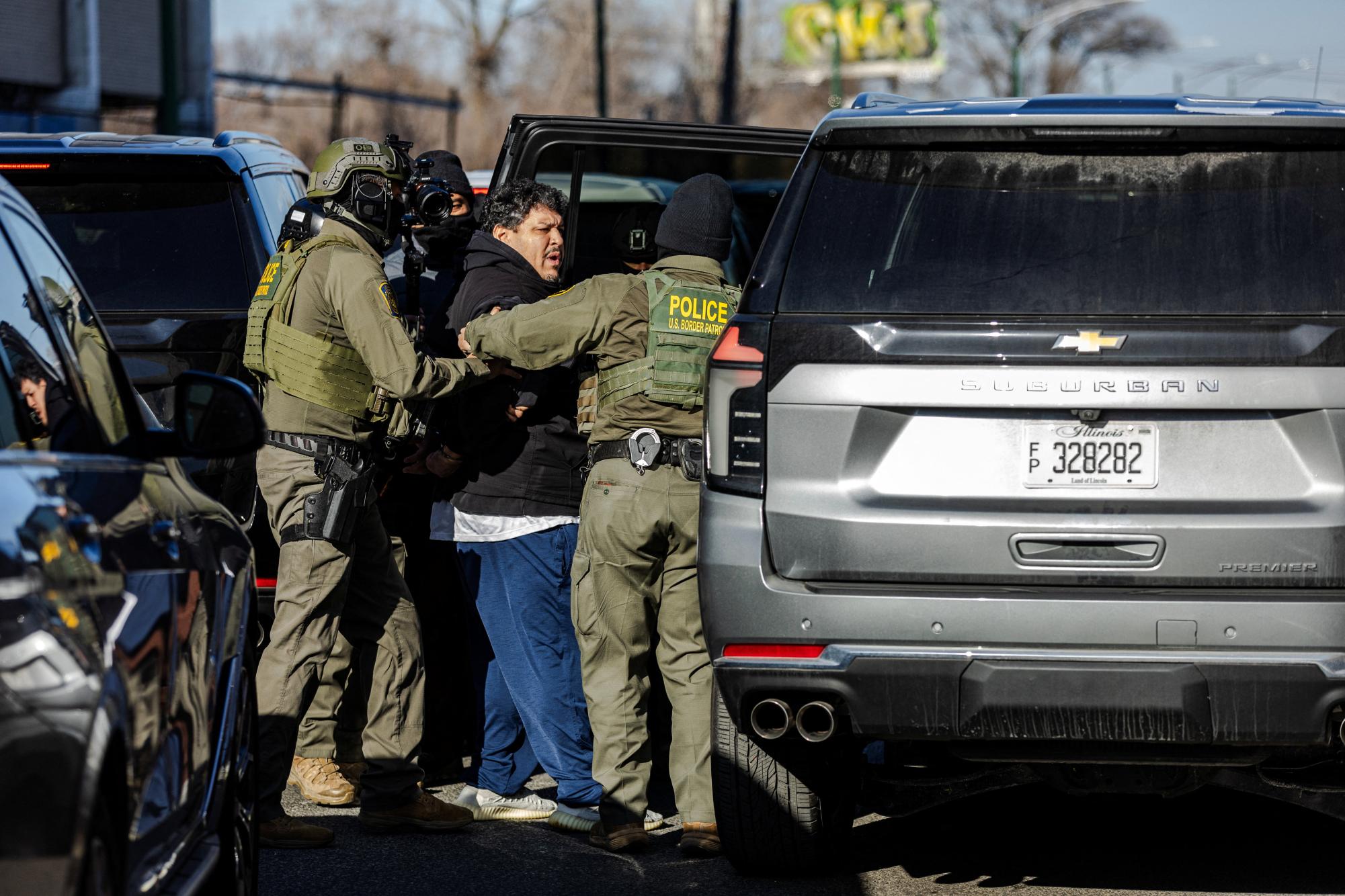 U.S. federal agents detain a man during an immigration raid, after U.S. President Donald Trump ordered increased federal law enforcement presence to assist in crime prevention, in the Little Village neighborhood of Chicago, Illinois, U.S., December 16, 2025. REUTERS/Jim Vondruska