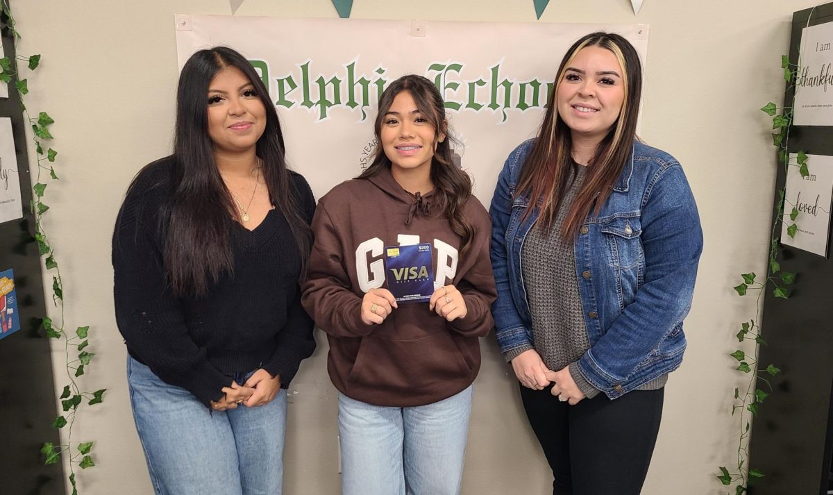 Yearbook editors Johana Moreno and Marianna Nino along with advisor Mrs. Valdez showing off their gift card prize from Lifetouch.