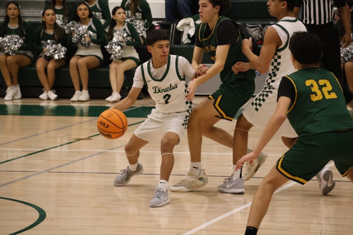 Jaden Herrera (2) dribling against Kingsburg High (preseason game)