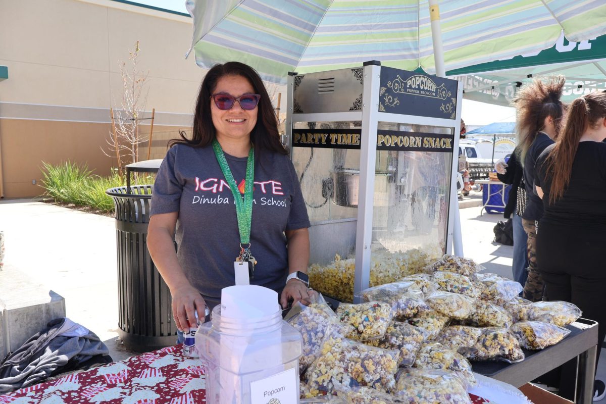 Ms. Montalvo selling popcorn for Ignite Club