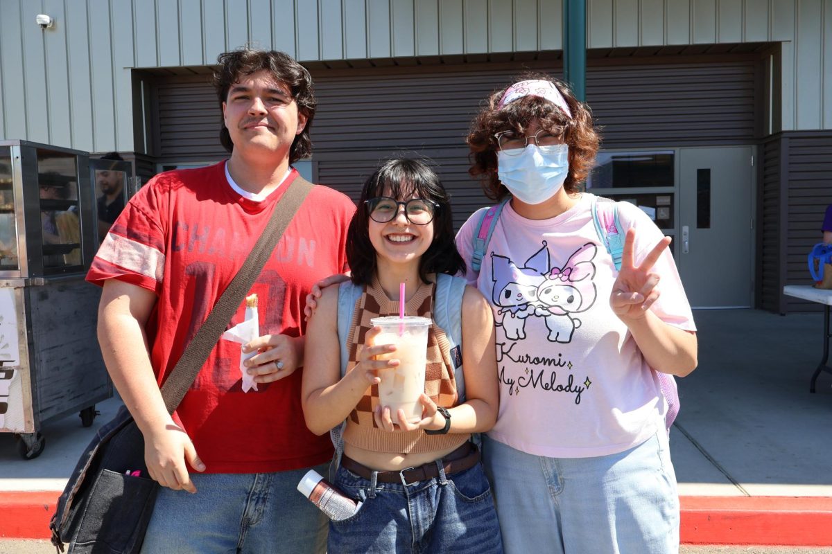 Students, Ethan Martin, Sadie Gonzales, and Amy Cardenas, enjoying their food