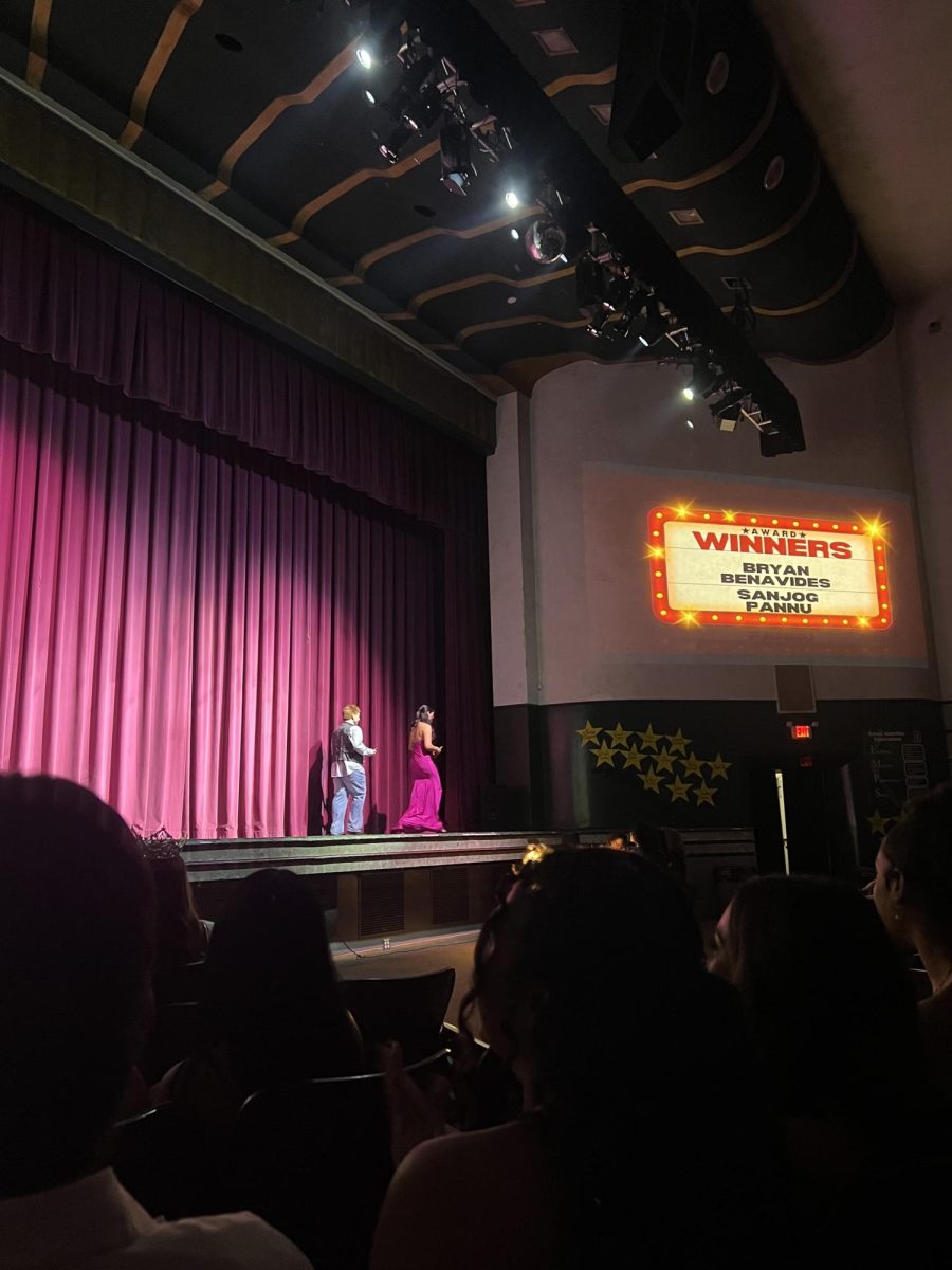 Bryan Benavides and Sanjog Pannu leaving the stage as they accept Most Involved award